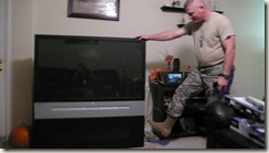 But, out with the old!  Here he is giving the old TV "the boot!"