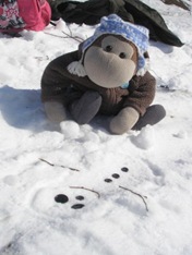 snowman lieing in the snow
