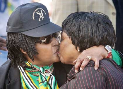 [Murdock Alan picture of Winnie Mandela left kissing ex health minister Manto TshabalalaMsimang R[5].jpg]