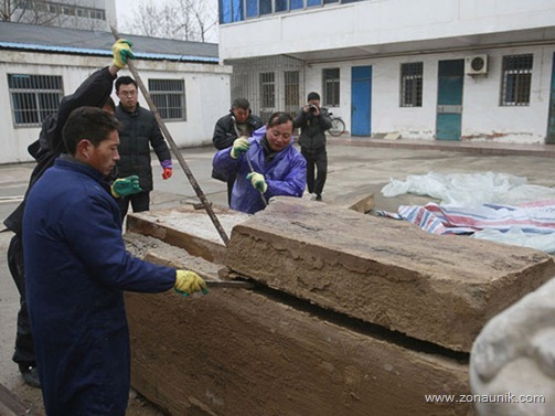 Archaeologists discover well preserved body of 700-year-old woman, Taizhou, Jiangsu Province, China - 01 Mar 2011...Mandatory Credit: Photo by Quirky China News / Rex Features ( 1292808b )
 Archaeologists open the stone coffin containing the body of the 700-year-old Ming Dynasty woman
 Archaeologists discover well preserved body of 700-year-old woman, Taizhou, Jiangsu Province, China - 01 Mar 2011
 Archaeologists in China have unearthed the 700-year-old Ming Dynasty corpse of a woman from a tomb under a building site. The remarkably preserved mummy was discovered inside a coffin in Taizhou, eastern China's Jiangsu Province. The coffin was one of the three discovered in a tomb 2 meters below the ground at a construction lot in the city. Researchers from the Taizhou Museum carefully opened the coffins. In two they found skeletons, Ming Dynasty clothes and funerary objects. However, in the third they found the well preserved woman's body.
