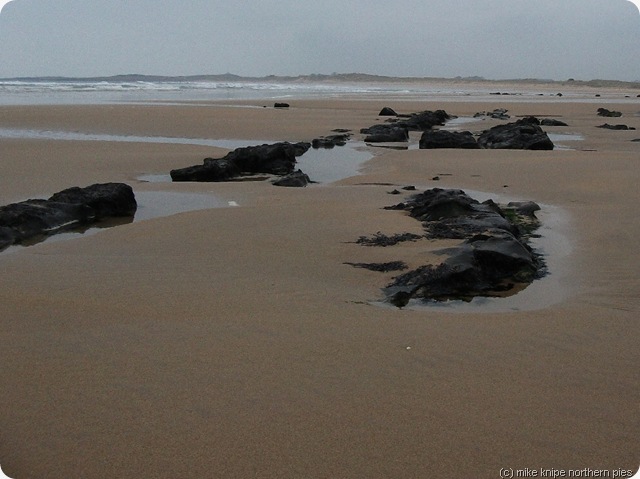 whin sill outcrops in beadnell bay