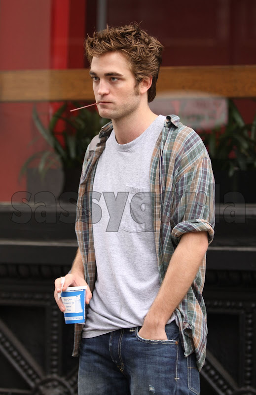 Robert Pattinson bites a Coffee Stirrer and Smokes!