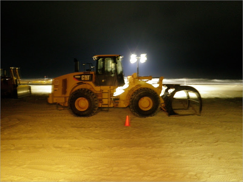 This how they moved the pip around the beach. The piece of equipment is called a loader.