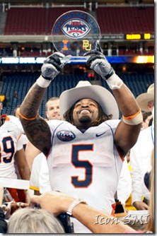 27 December 2010; 2010 Texas Bowl- Baylor Bears v Illinois Fighting Illini; Illinois Fighting Illini running back Mikel Leshoure (5) hoists his MVP trophy after the game; Illinois won 38-14