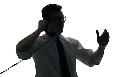 Dealing with bill errors doesn't have to be an ordeal. A man dealing with bill charge errors over the phone.
