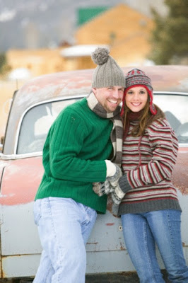 Get winter-prepared with payday loans! A couple smililng and standing near a newly repaired vehicle.