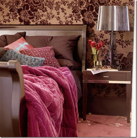 Accessories: glamorous opulent; bedroom; copper/brown floral fabric / wallpaper; embossed cushion, pink/red velvet quilt; sleigh bed; carpet, sidetable, table lamp.   Pub orig    L etc 10/2005 p52
