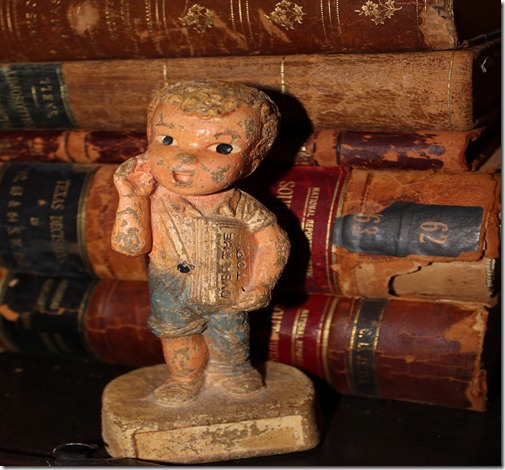 newsboy figurine books behind (2)
