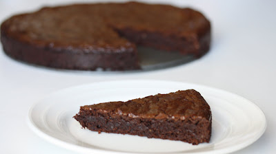 photo of a slice of Flourless Chocolate Hazelnut Torte on a plate