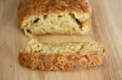 close-up photo of a slice of Cheesy Beer Bread