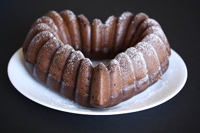 photo of a Cinnamon Chocolate Heart-shaped Bundt Cake dusted with powdered sugar