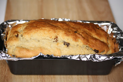 photo of a loaf of Irish Soda Bread in a pan