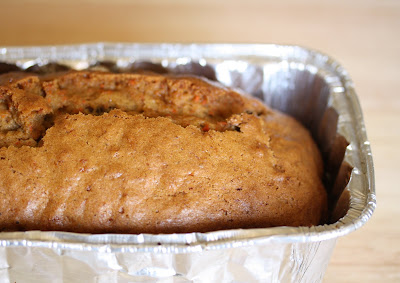 close-up photo of a loaf of carrot bread in a pan