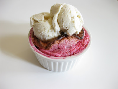 photo of a raspberry souffle topped with ice cream