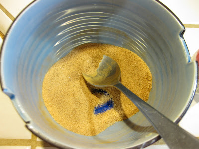 cinnamon sugar being mixed in a bowl