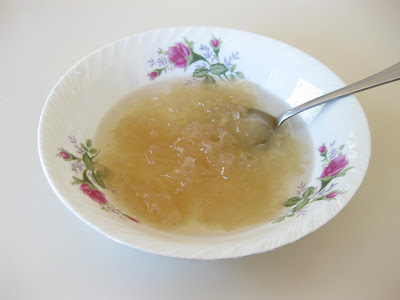 photo of a bowl of white fungus soup with a spoon