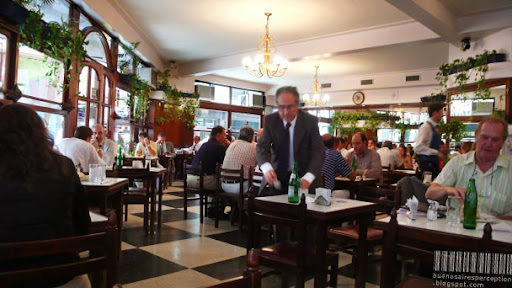 A Man is Paying His Bill in a Café in Downtown Buenos Aires, Argentina