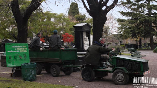 Gardeners on a Small Ride in the La Chacarita Cemetery in Buenos Aires, Argentina