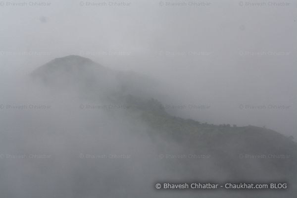 Very dense monsoon clouds covering the forest peaks