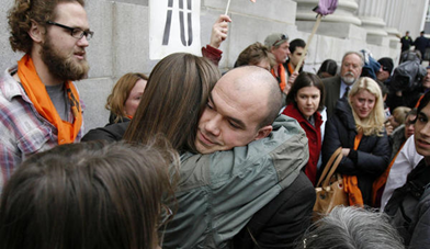Tim DeChristopher hugs people as he leaves court following a guilty verdict on two federal charges — interfering with an onshore oil and gas leasing act and making a false representation to the federal government — in Salt Lake City on Thursday, March 3, 2011. Ravell Call, Deseret News