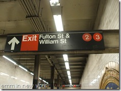 Signs at Fulton Street subway