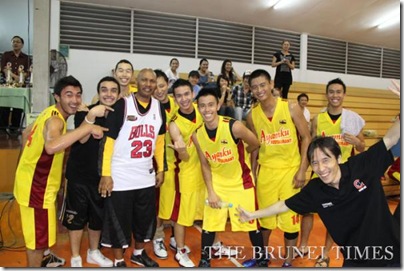 The national basketball team, under the banner of Soon Lee-Easyway 'A', celebrate with Kevin Reece, the national basketball coach, after their 113-53 triumph over Hata Rekajaya Sdn Bhd in the final of the 2010 Goh Hock Kee Cup at the Brunei Basketball Association court in Batu Bersurat. Picture: BT/Yee Chun Leong