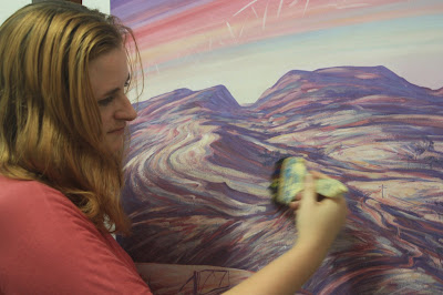 Wendy Grace Allen overworking Helen Stacey's painting.