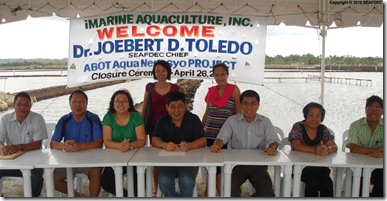 Ms. Betty Lua, AQD Chief Dr. Joebert Toledo, and Mr. Fortunato Sanchez Jr. sign the closure agreement (seated, 3rd to 5th from left, respectively) as witnessed by the Lua family members
