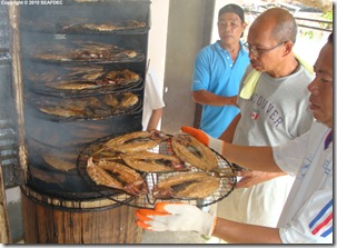 Smoking bangus (in the middle is one of the small-business entrepreneurs)