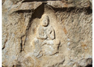 Gyeongju Half-Seated Buddhist Saint Statue Carved on a Rock at Sinseonam