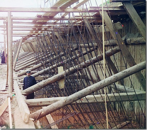 Construction of iron-concrete frames for the lock's walls, Beloomut, Uniformed man posed in framework of lock; 1912
Sergei Mikhailovich Prokudin-Gorskii Collection (Library of Congress).