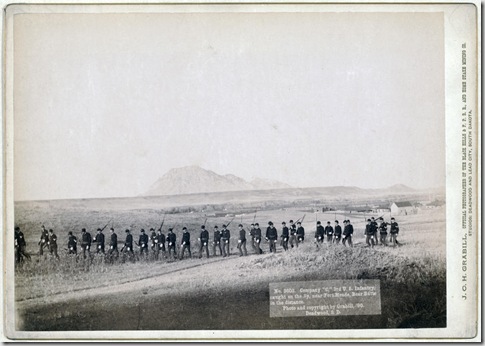 Title: Company "C," 3rd U.S. Infantry, caught on the fly, near Fort Meade. Bear Butte in the distance
Thirty five soldiers walking in a line with rifles. 1890.
Repository: Library of Congress Prints and Photographs Division Washington, D.C. 20540