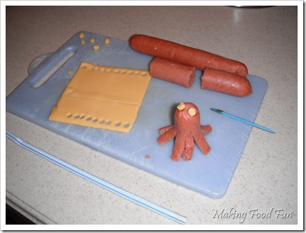 octopus, eyes out of cheese, cut with straw
