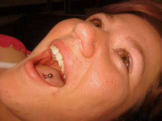 Women with broad laughter pierced tongue barbell, photos and image