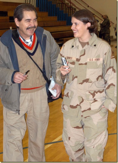 Doug Hunt with Spc. Billie Grimes at Western Boone High School on Jan. 6, 2004. Time magazine named the U.S. military its Person of the Year for 2003 and Grimes was chosen as one of three soldiers to appear on the Person of the Year issue cover. She was a graduate of Western Boone and the whole community turned out to welcome her home from Iraq.
Photo by John Flora