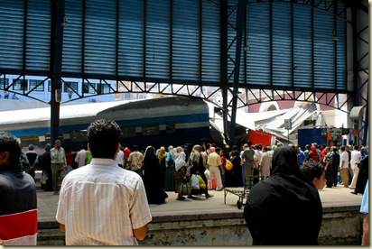 Repair crews from Egyptian Railways lifting derailed train cars