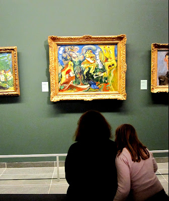 Viewing art in the Musée de l'Orangerie, Paris