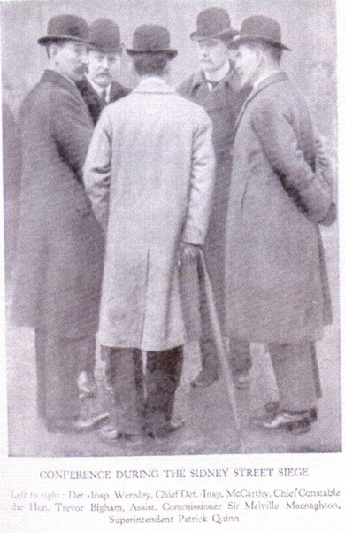 John McCarthy conferring with other senior officers during the Sidney Street siege
