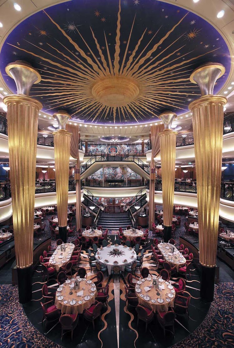 A grand view of the impressive three-level main dining room on Explorer of the Seas.