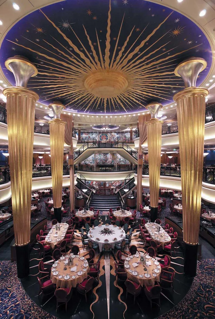 A grand view of the impressive three-level main dining room on Explorer of the Seas.