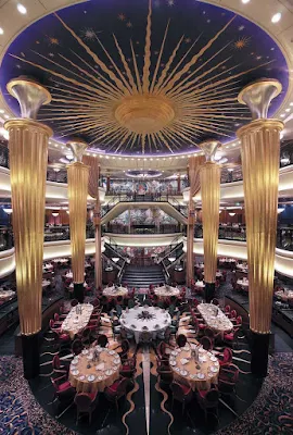 A grand view of the impressive three-level main dining room on Explorer of the Seas.