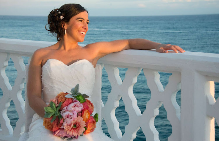 A bride in the late afternoon glow at Curtain Bluff Resort in Antigua and Barbuda, a popular venue for weddings. 