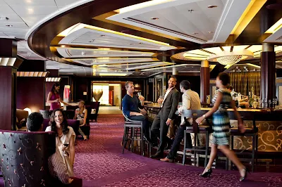 Mingle and meet new people over drinks in Celebrity Solstice's Ensemble lounge.