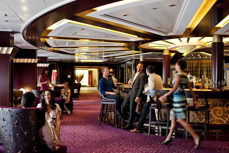 Mingle and meet new people over drinks in Celebrity Solstice's Ensemble lounge.