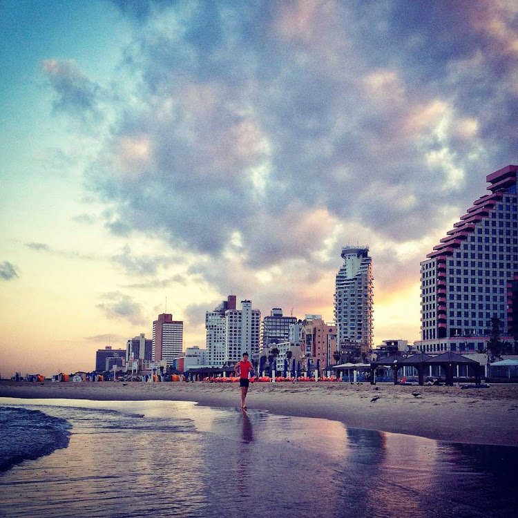 Sunset on the beach in Tel Aviv, Israel.