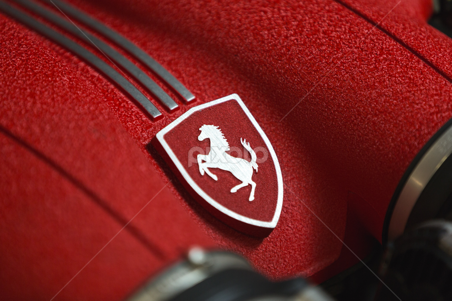 Ferrari Engine Logo Close Up by Cody Gephart - Transportation Automobiles