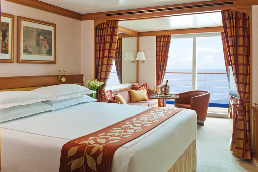 Regent-Seven-Seas-Navigator-Deluxe-Concierge-Suite - At 356 square feet, Seven Seas Navigator's Concierge Suite features a European king-size bed, marble bathroom, privacy balcony, sitting area, flat screen TV, mini-bar and free wi-fi. It fits three comfortably. 