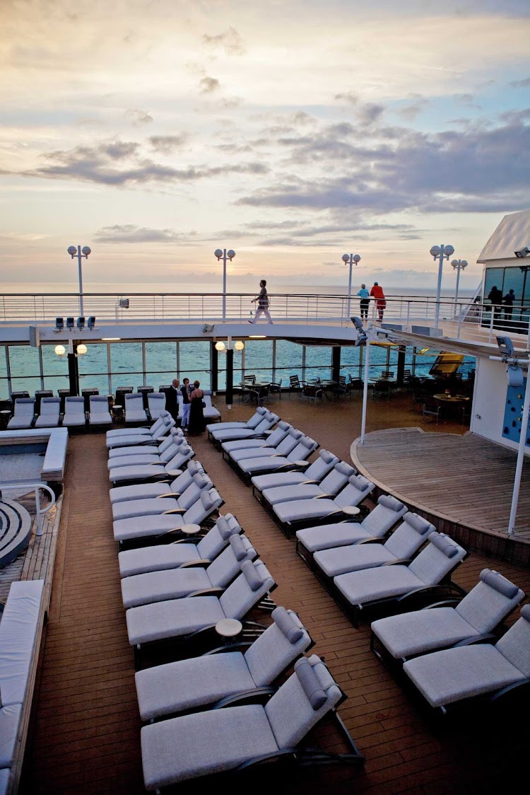 Relax in the ocean breeze while lounging poolside on your Azamara Quest cruise.