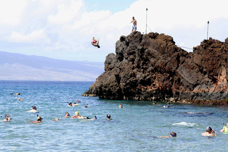 Black Rock, bordering one end of marvelous Kaanapali Beach on Maui, attracts snorkelers and cannon-ballers.