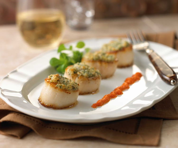 Capesante al Forno (Baked Scallops in the Shell), prepared for guests on a Royal Caribbean cruise.